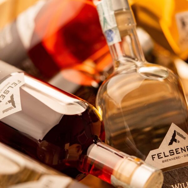 Close-up of FELSENP distillery bottles with distinctive labeling, showcasing their product range.