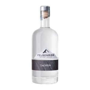Felsenriss Brennerei-Distillery Lagrein bottle, clear with mountain logo and dark label, isolated on white.