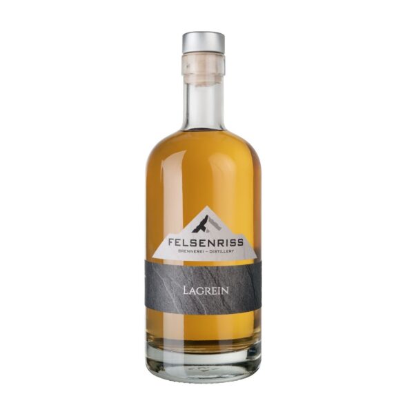 Felsenriss Lagrein bottle: clear glass, amber liquid, grey label. Silver cap.