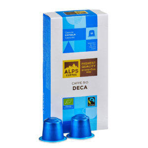 Box of Alps Coffee Deca capsules with two blue capsules in front. Fairtrade and organic certified coffee.