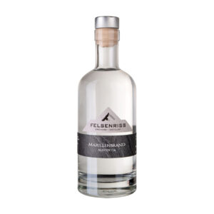 Bottle of Felsenriss Marillenbrand Abricocca brandy, with a silver cap and a label with a bird and mountain design.