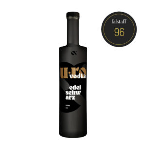 Bottle of U-RO Vodka, Edel Schwarz, with a 96 Falstaff rating. Black bottle with gold lettering.