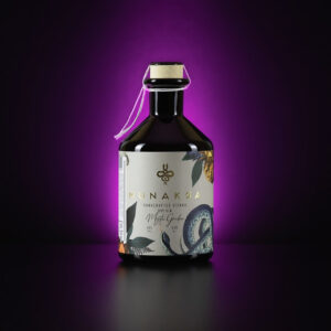 A bottle of Munakra Vienna Dry Gin, Mystic Garden variety, with a purple background and snake on the label.